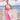 Mono Becka rosa con capote blanco