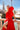 Vestido Jara rojo con volante floral en hombro