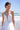 Vestido bridal blanco roto con falda capa