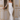 Vestido invitada con plumas y brillo elegante