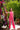 Mono Yuna rosa coral con lazo rojo
